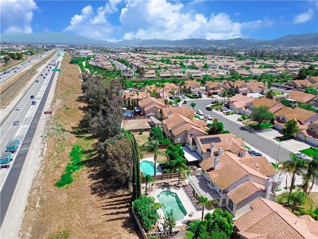24062 Fuschia Ct, Murrieta, CA 92562 - aerial perspective of suburban area with a mountainous background, a main thoroughfare, and a pool area