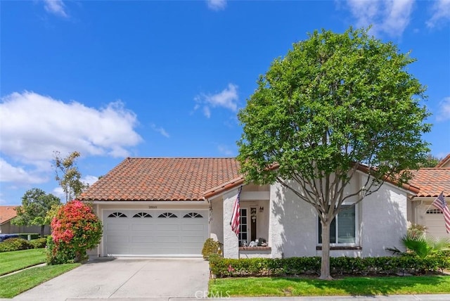 28501 Cano, Mission Viejo, CA 92692 - mediterranean / spanish house with stucco siding, a garage, a tiled roof, and concrete driveway