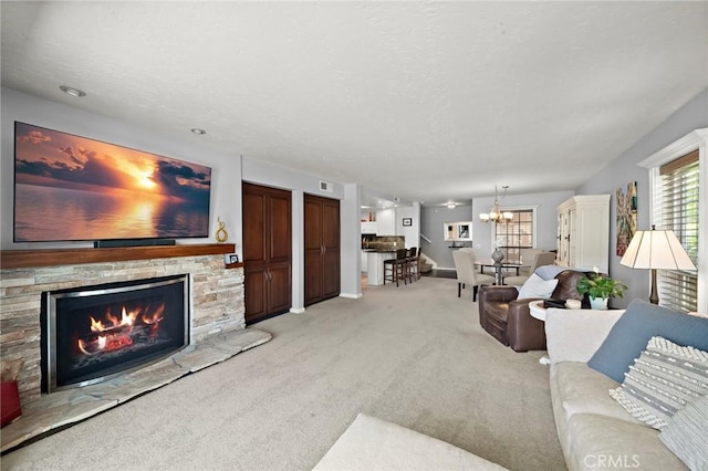 994 Bayside Cv, Newport Beach, CA 92660 - living area featuring light colored carpet, a fireplace, a chandelier, and baseboards