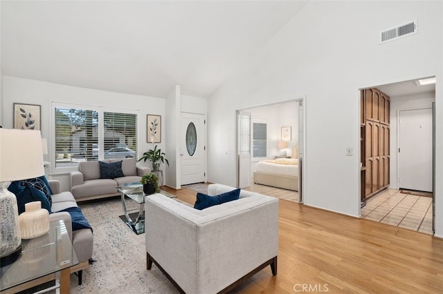566 Elkhorn Dr, Duarte, CA 91010 - living room featuring light wood-style floors and high vaulted ceiling
