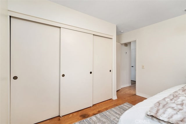 566 Elkhorn Dr, Duarte, CA 91010 - bedroom featuring light wood finished floors, a closet, and baseboards
