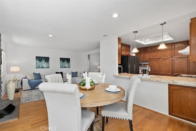 566 Elkhorn Dr, Duarte, CA 91010 - dining room featuring light wood finished floors, recessed lighting, and a raised ceiling