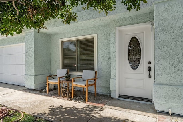 566 Elkhorn Dr, Duarte, CA 91010 - doorway to property with stucco siding and a garage