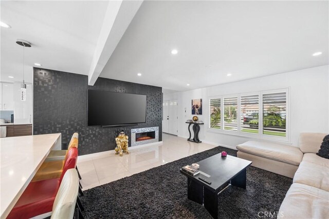 20191 Imperial Cove Ln, Huntington Beach, CA 92646 - living area with baseboards, recessed lighting, wallpapered walls, a lit fireplace, and an accent wall