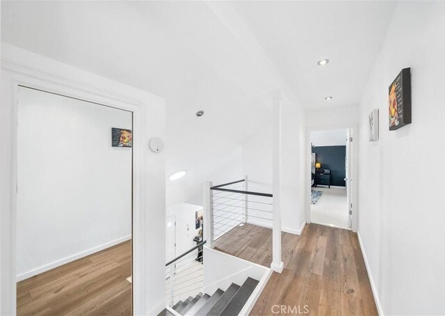 20191 Imperial Cove Ln, Huntington Beach, CA 92646 - hallway featuring an upstairs landing, wood finished floors, baseboards, and recessed lighting