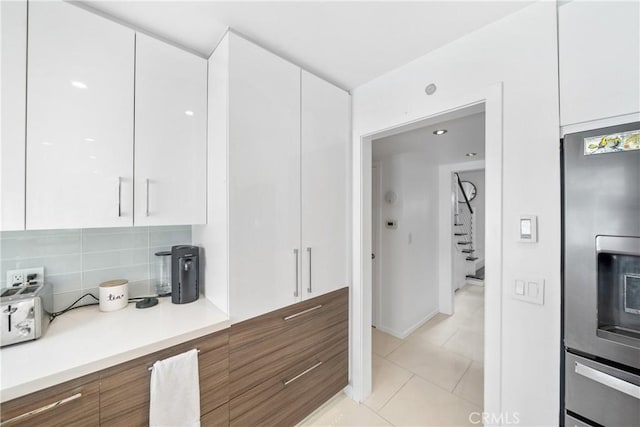 20191 Imperial Cove Ln, Huntington Beach, CA 92646 - kitchen featuring stainless steel fridge with ice dispenser, white cabinets, modern cabinets, and light countertops