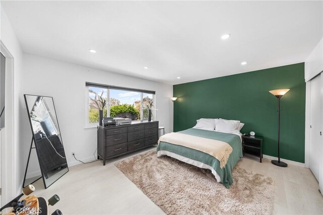 20191 Imperial Cove Ln, Huntington Beach, CA 92646 - bedroom with recessed lighting, light wood finished floors, an accent wall, and baseboards