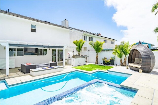 20191 Imperial Cove Ln, Huntington Beach, CA 92646 - view of pool featuring a fenced backyard, a patio, exterior kitchen, and a pool with connected hot tub