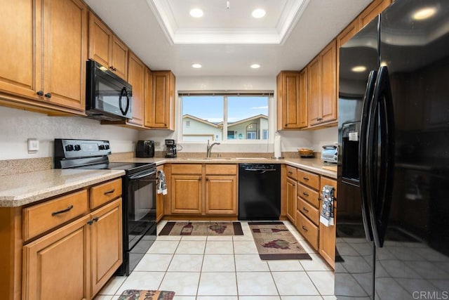 634 Via, Santa Paulo, Vista, CA 92081 - kitchen featuring black appliances, a raised ceiling, light countertops, a sink, and brown cabinets