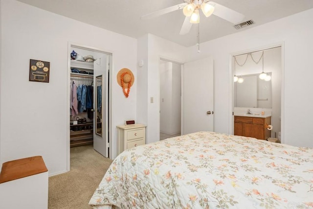 634 Via, Santa Paulo, Vista, CA 92081 - bedroom featuring light carpet, a spacious closet, a closet, a sink, and ensuite bath