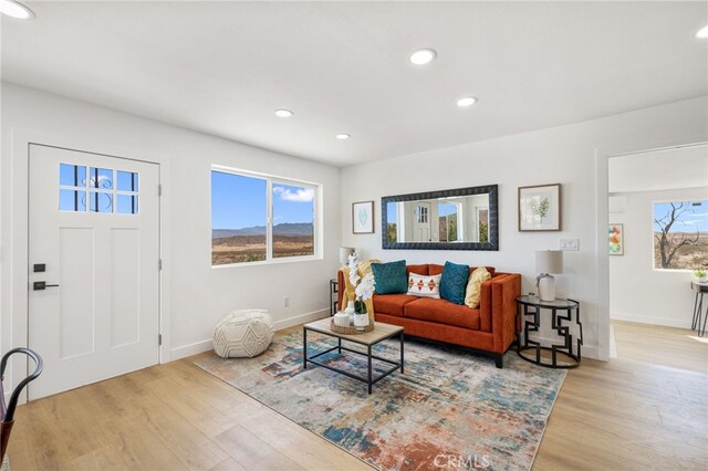 21408 Apollo Way, Desert Hot Springs, CA 92241 - living room featuring wood finished floors, baseboards, and recessed lighting