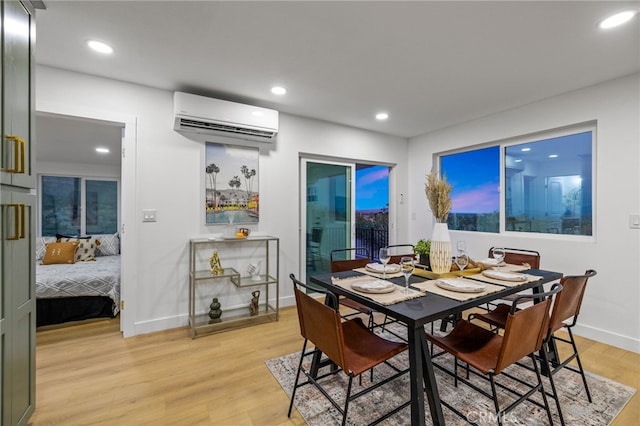 21408 Apollo Way, Desert Hot Springs, CA 92241 - dining space with a wall mounted air conditioner, light wood finished floors, recessed lighting, and baseboards