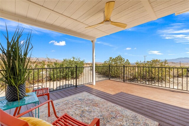 21408 Apollo Way, Desert Hot Springs, CA 92241 - wooden deck with a ceiling fan and a mountain view