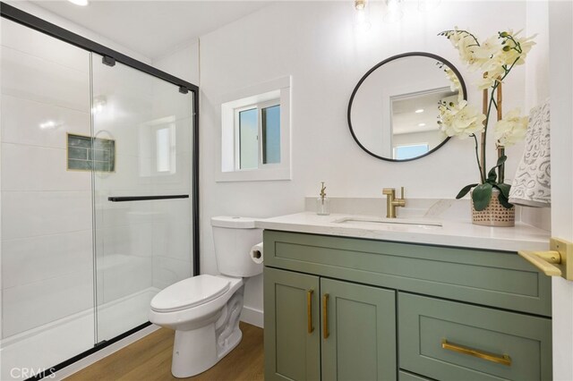 21408 Apollo Way, Desert Hot Springs, CA 92241 - full bathroom featuring a shower stall, toilet, wood finished floors, and vanity