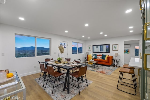 21408 Apollo Way, Desert Hot Springs, CA 92241 - dining area featuring baseboards, light wood-type flooring, recessed lighting, and a wall unit AC