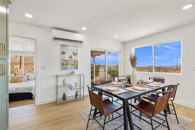 21408 Apollo Way, Desert Hot Springs, CA 92241 - dining area with a wall mounted AC, light wood-style floors, baseboards, and recessed lighting