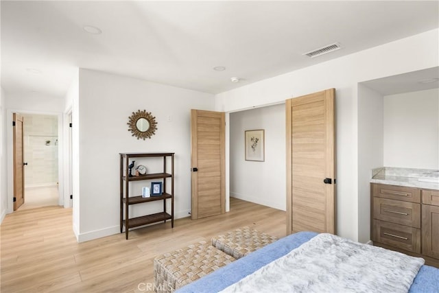 1909 Montair Ave, Long Beach, CA 90815 - bedroom with light wood-style floors, baseboards, and ensuite bath