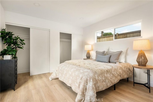 1909 Montair Ave, Long Beach, CA 90815 - bedroom featuring multiple closets, light wood-type flooring, and baseboards