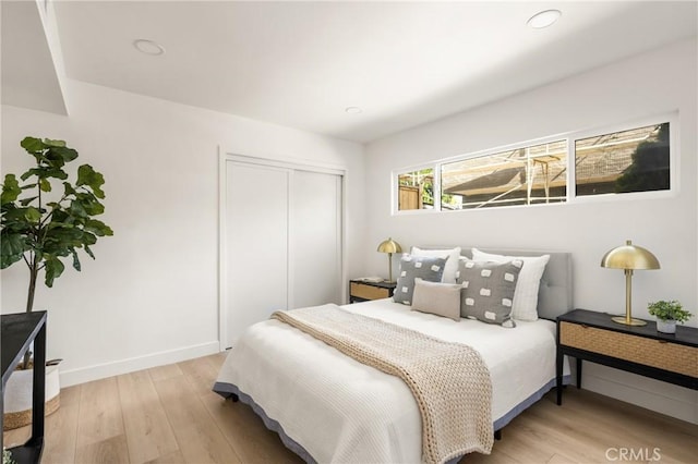 1909 Montair Ave, Long Beach, CA 90815 - bedroom featuring light wood-style floors, a closet, and baseboards