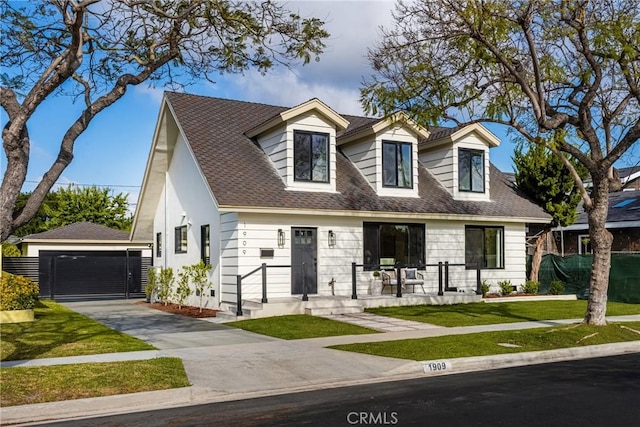 1909 Montair Ave, Long Beach, CA 90815 - view of front facade with an outdoor structure, a front lawn, a garage, and roof with shingles