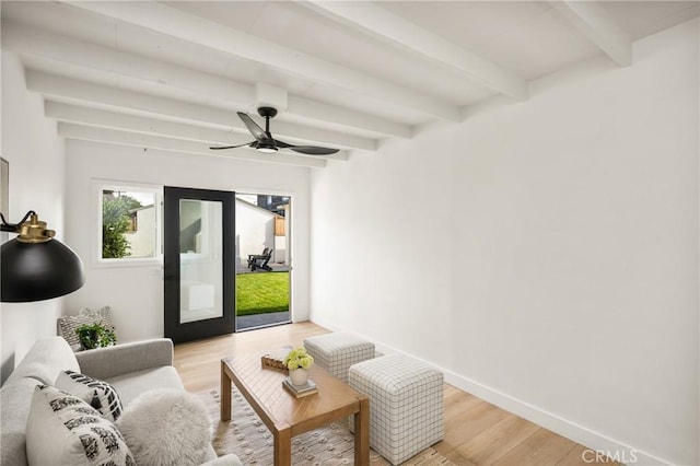 1909 Montair Ave, Long Beach, CA 90815 - living room with beam ceiling, light wood finished floors, ceiling fan, and baseboards