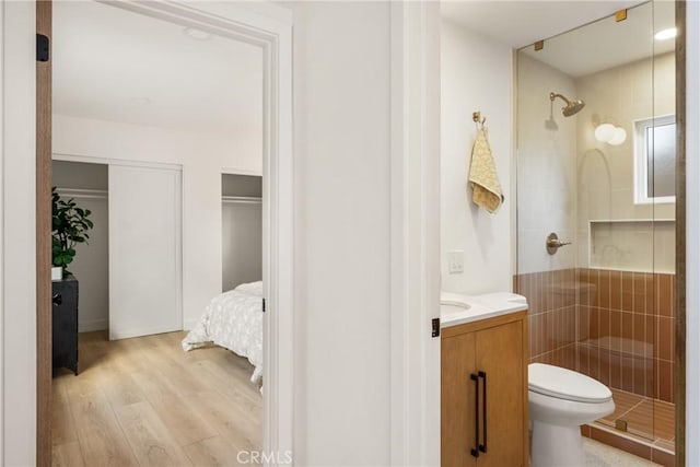 1909 Montair Ave, Long Beach, CA 90815 - bathroom featuring a shower stall, wood finished floors, vanity, and toilet