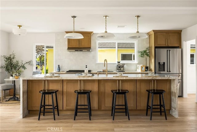 1909 Montair Ave, Long Beach, CA 90815 - kitchen with high end refrigerator, a sink, under cabinet range hood, a spacious island, and light wood-type flooring