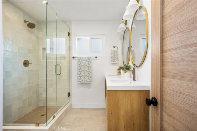 1909 Montair Ave, Long Beach, CA 90815 - bathroom featuring a stall shower, baseboards, and double vanity