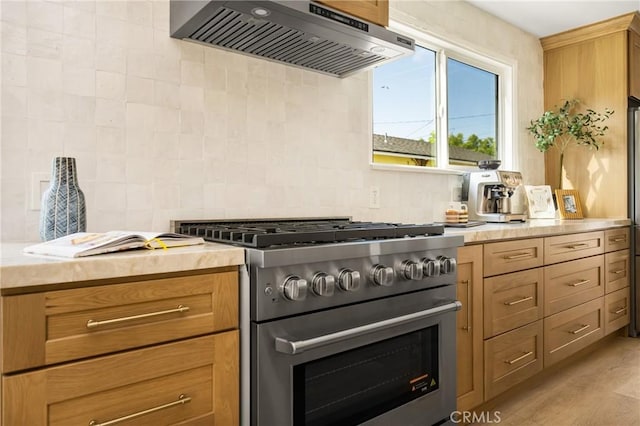 1909 Montair Ave, Long Beach, CA 90815 - kitchen featuring high end range, ventilation hood, light countertops, and tasteful backsplash