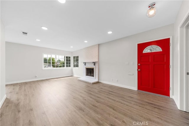 116 N Wildwood Ave, Glendora, CA 91741 - unfurnished living room with wood finished floors, baseboards, a fireplace, and recessed lighting