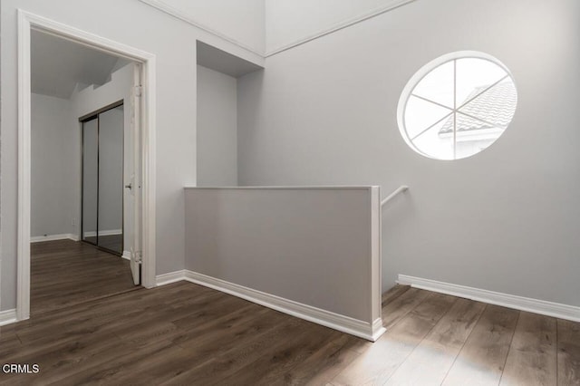 9216 Tobias Ave Unit 22, Panorama City, CA 91402 - hall with an upstairs landing, dark wood-style flooring, and baseboards