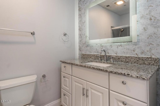 9216 Tobias Ave Unit 22, Panorama City, CA 91402 - bathroom featuring toilet, vanity, and a shower with door
