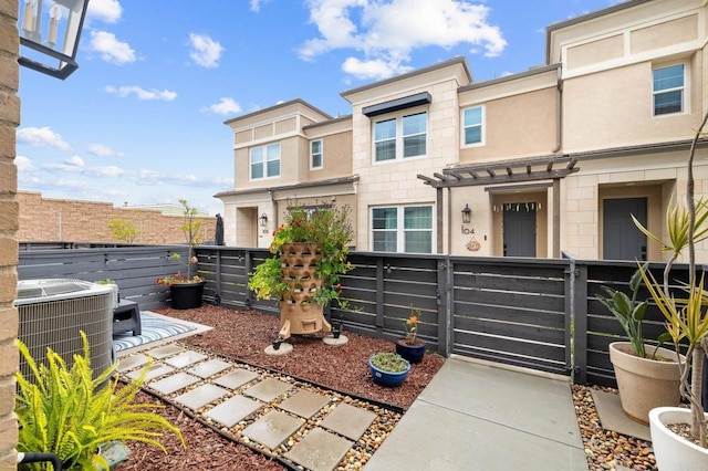 1211 Sunrise Vw Unit 104, San Marcos, CA 92078 - exterior space featuring cooling unit, fence, a gate, and stucco siding
