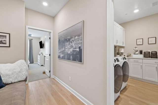 1211 Sunrise Vw Unit 104, San Marcos, CA 92078 - laundry room with cabinet space, independent washer and dryer, light wood finished floors, baseboards, and recessed lighting