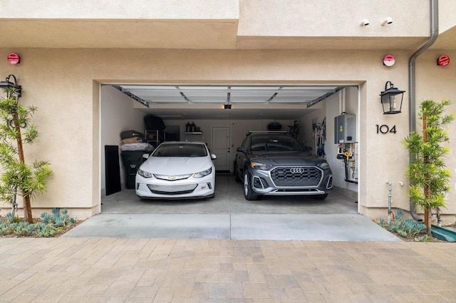 1211 Sunrise Vw Unit 104, San Marcos, CA 92078 - garage with water heater and driveway