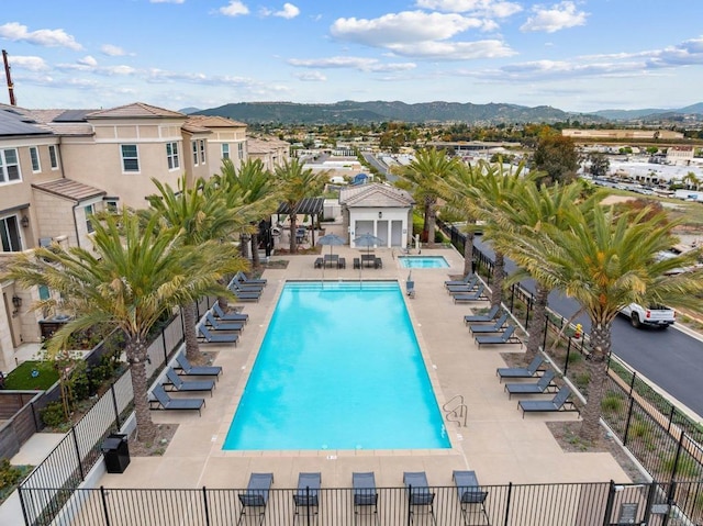 1211 Sunrise Vw Unit 104, San Marcos, CA 92078 - community pool with a mountain view, fence, and central AC unit