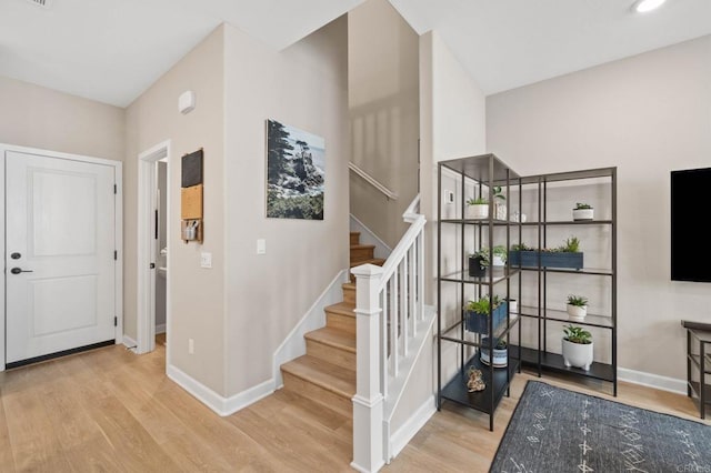 1211 Sunrise Vw Unit 104, San Marcos, CA 92078 - entryway with wood finished floors, baseboards, and stairs