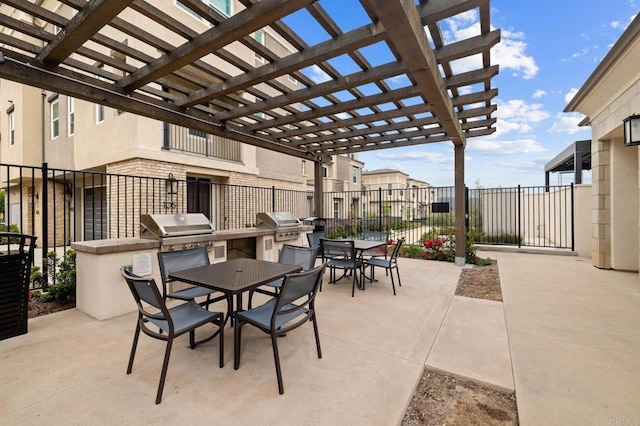 1211 Sunrise Vw Unit 104, San Marcos, CA 92078 - view of patio featuring outdoor dining area, an outdoor kitchen, fence, a pergola, and a grill