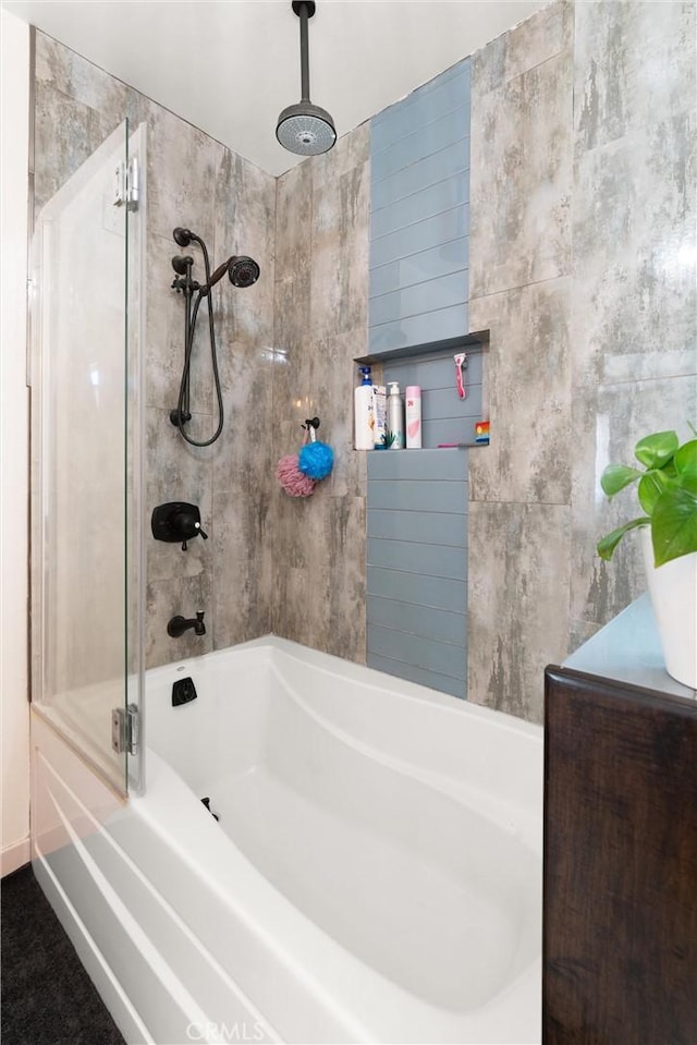 bathroom featuring a combined bath / shower with rainfall shower