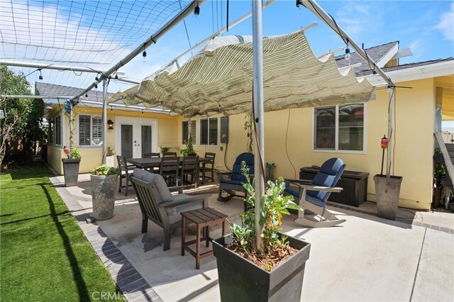 view of patio / terrace featuring french doors and outdoor dining area