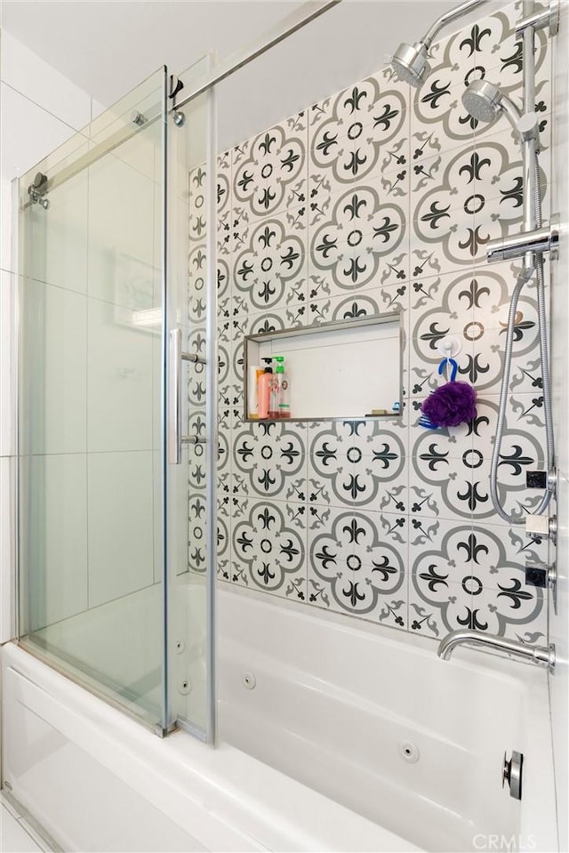 bathroom with a combined bath / shower with jetted tub