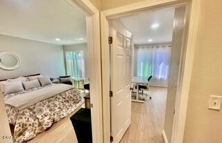 bedroom featuring wood finished floors and recessed lighting
