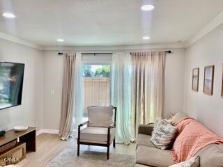 257 W Channel Islands Blvd, Port Hueneme, CA 93041 - living room featuring crown molding, light wood-style floors, and recessed lighting