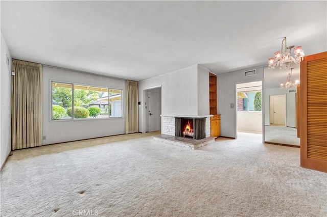 926 E Dalton Ave, Glendora, CA 91741 - unfurnished living room featuring a chandelier, plenty of natural light, a brick fireplace, and carpet
