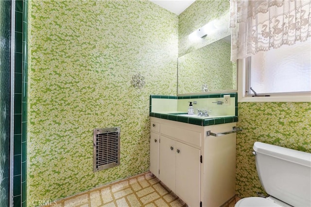 926 E Dalton Ave, Glendora, CA 91741 - bathroom with toilet, wallpapered walls, vanity, and tile walls