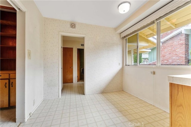 926 E Dalton Ave, Glendora, CA 91741 - unfurnished room featuring light floors and wallpapered walls