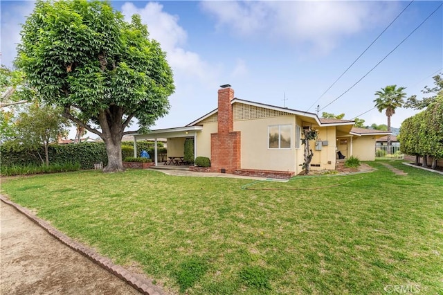 926 E Dalton Ave, Glendora, CA 91741 - back of house featuring stucco siding, a chimney, and a patio