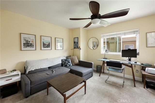 290 Victoria St Unit 19, Costa Mesa, CA 92627 - living room with a desk, carpet flooring, a ceiling fan, and baseboards