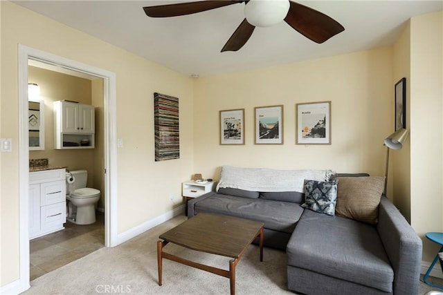 290 Victoria St Unit 19, Costa Mesa, CA 92627 - living area featuring ceiling fan, light colored carpet, and baseboards