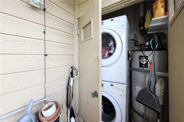 290 Victoria St Unit 19, Costa Mesa, CA 92627 - clothes washing area featuring stacked washing machine and dryer and water heater